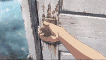a close up of a person 's hand holding a door knob .