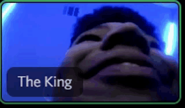 a close up of a person 's face with the words the king written below it