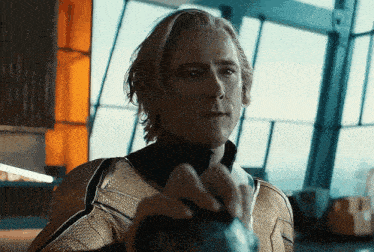 a close up of a man 's face in a superhero suit