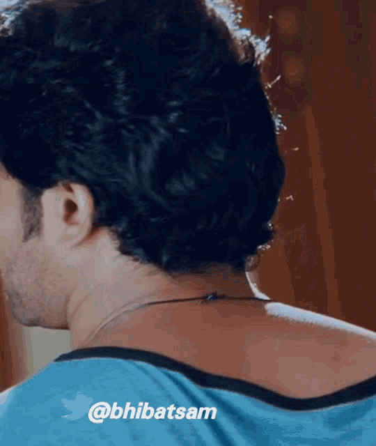 a close up of a man 's neck with the hashtag @bhlibatsam on the bottom
