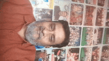 a man with a beard is smiling in front of a wall of pictures including one that says ' celebration ' on it