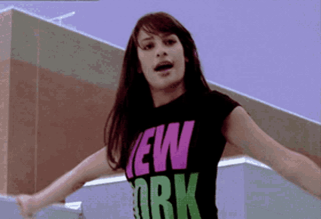 a girl wearing a shirt that says new york
