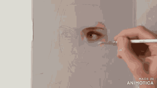 a person is painting a picture of a woman 's face with a brush .