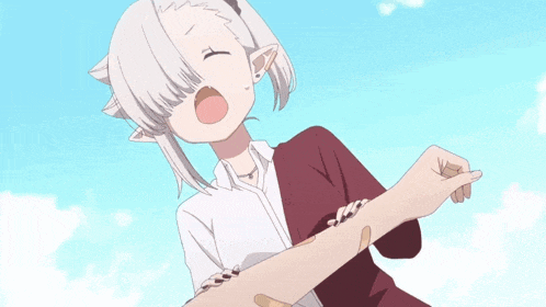 a girl with a bandage on her arm is being held by someone