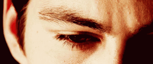 a close up of a man 's eye with his eyebrows visible