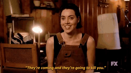 a woman in overalls is smiling and saying " they 're coming and they 're going to kill you "