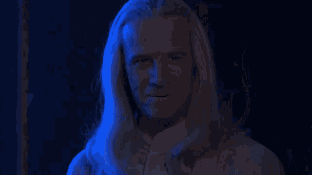 a man with long white hair is laughing with the words ha! ha! ha! behind him