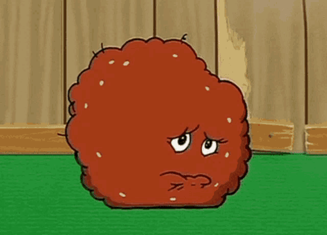 a cartoon chicken nugget with a sad look on its face