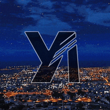 a city at night with the letter y and i in the foreground
