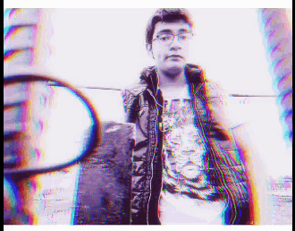 a blurry picture of a man standing in front of a reflection of himself