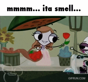 a cartoon of a girl holding a rose with the words " mmmm ita smell " below her