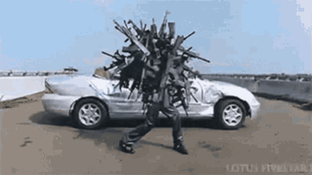 a man is carrying a bunch of guns on his head while walking next to a car