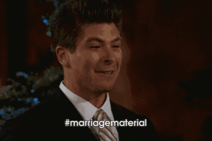 a man in a suit and tie is smiling and says marriagematerial