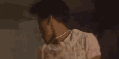a close up of a woman wearing headphones and a necklace .