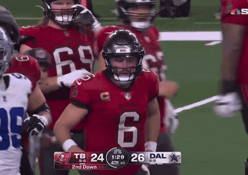 a football game is being played between the buccaneers and dallas cowboys