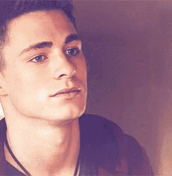 a close up of a young man 's face with his eyes closed .