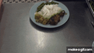 a plate of food on a table with the words make a gif.com under it