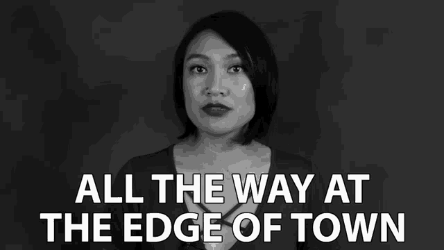 a black and white photo of a woman with the words " all the way at the edge of town "