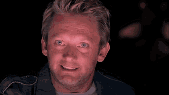 a man says tell me what you know on a dark background