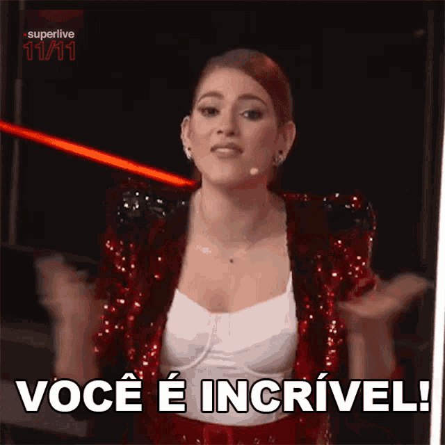 a woman in a red sequined jacket is saying você e incrivel