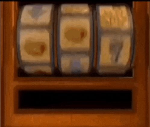 a slot machine with a lot of coins on it is spinning .