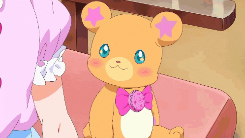 a teddy bear with a pink star on it 's head