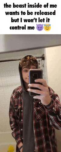 a young man in a plaid shirt is taking a selfie in front of a mirror