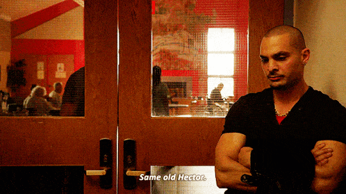 a man standing in front of a door with the words same old hector written on it