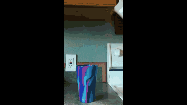 a bag of ice cream is poured into a cup