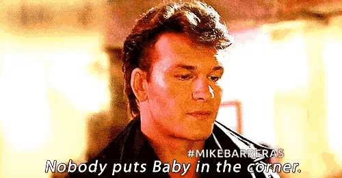 a man in a leather jacket is talking about a baby in the corner .