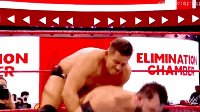 two men are wrestling in a ring with the words elimination chamber in the background