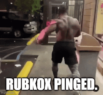 a man is walking down a street with the words rubkox pinged