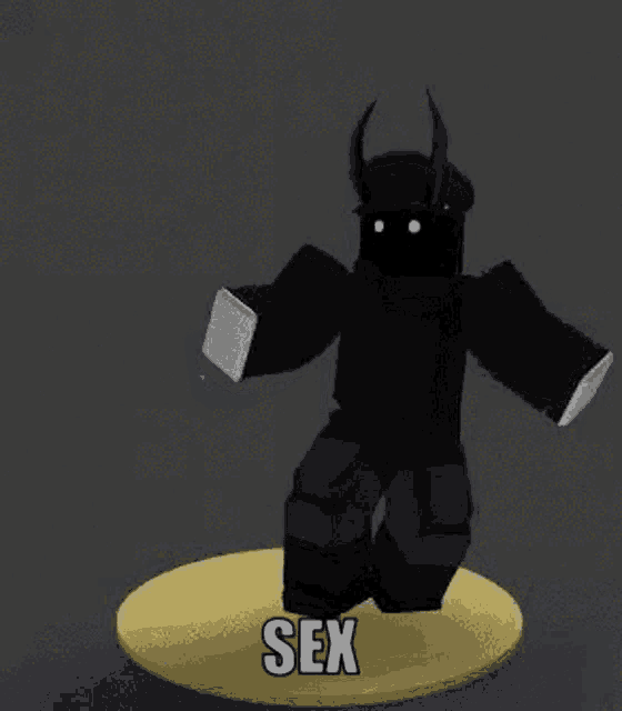 a black roblox character with horns and a hat is standing on a yellow circle .