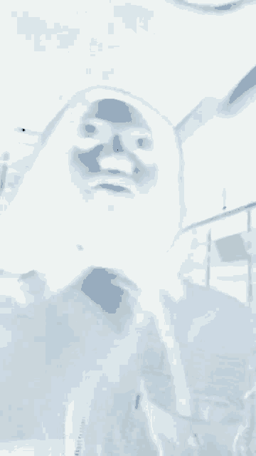 a blurred image of a person 's face with a beard