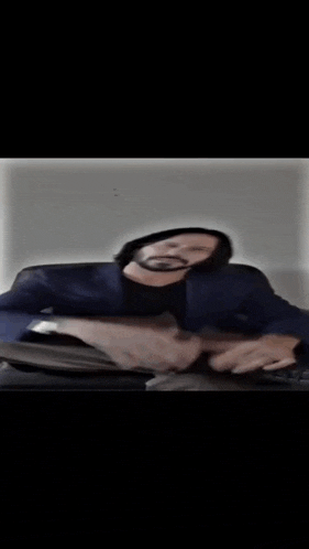 a blurry picture of a person 's face in a dark room .