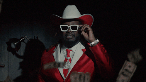 a man wearing a red hat and a white shirt with the words mother of god above him