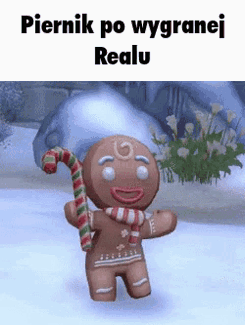 a gingerbread man is holding a candy cane in his hand