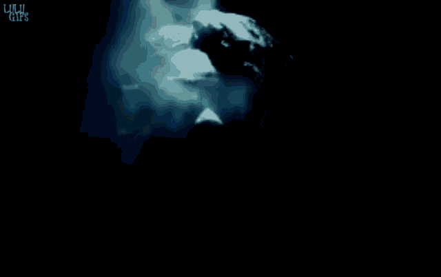a statue of a man is surrounded by smoke and the words lulu girls are on the bottom left