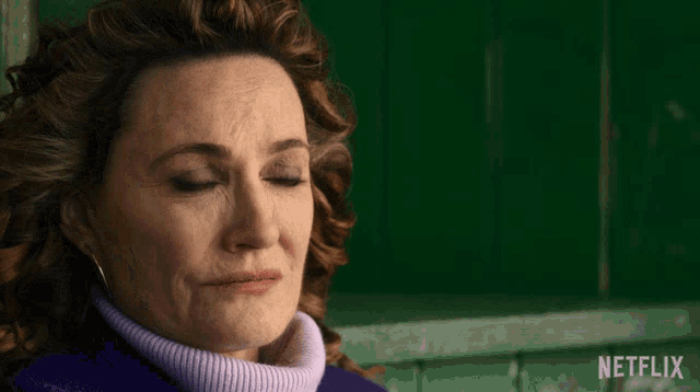 a woman says i 'm okay with it with a green background