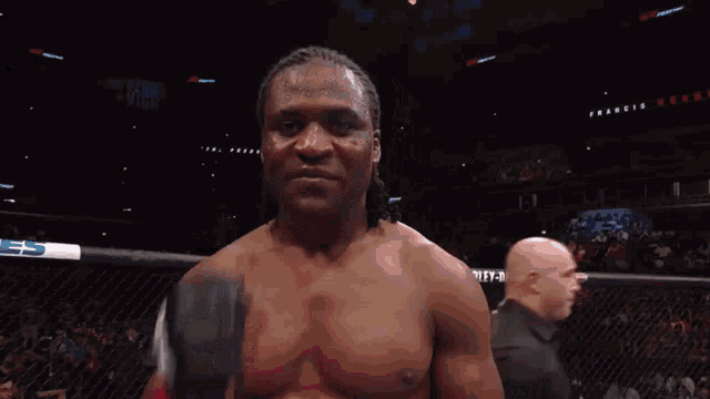 a man in a boxing ring with a glove that says ' ufc ' on it
