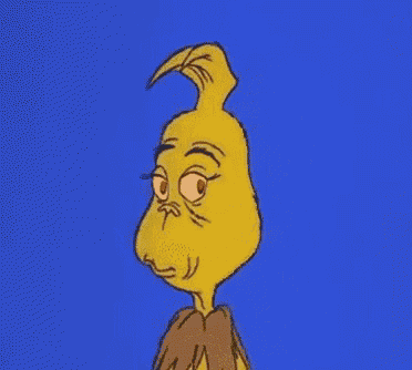 a cartoon character with a yellow face and red eyes is standing in front of a blue background and looking at the camera .