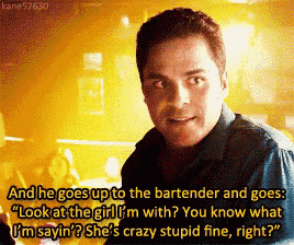 a man is talking to a bartender and says " look at the girl "