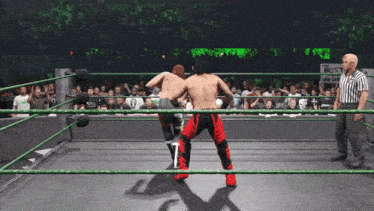 two wrestlers in a ring with a sign that says best here on it