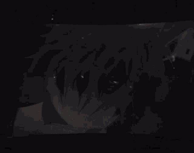 a shadow of a person 's face is cast on a wall .