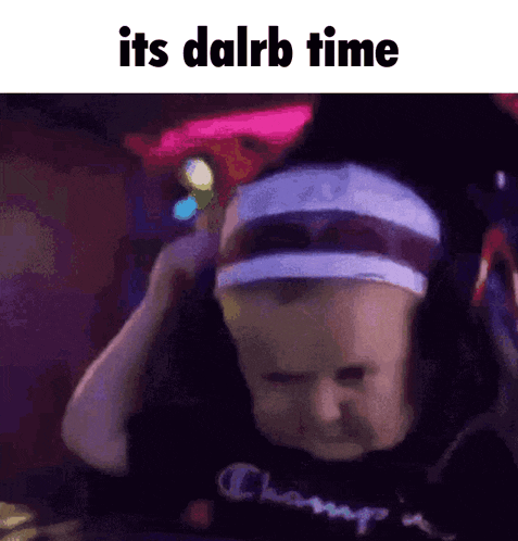 a baby wearing a headband with the words it 's dalrb time written on it .