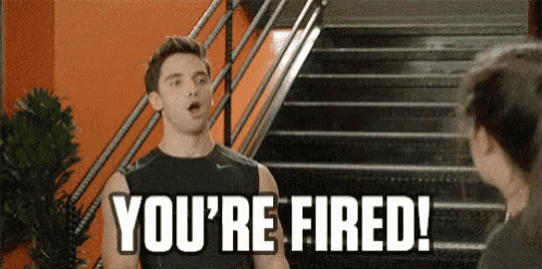 a man is standing on a set of stairs talking to a woman and says you 're fired !