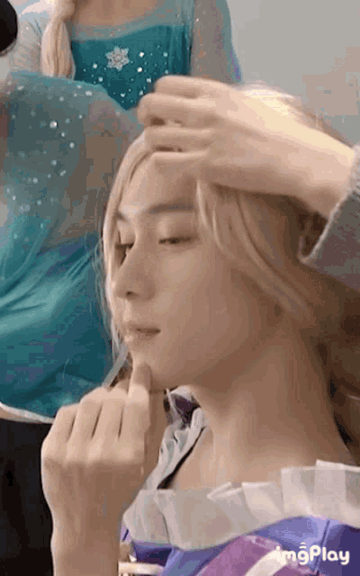 a close up of a person 's face with the words imgplay on the bottom right