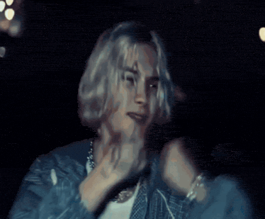 a blurry picture of a person 's face and arms