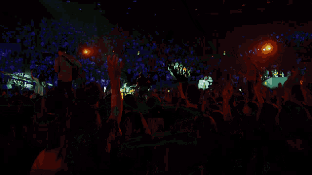 a man playing drums in front of a microphone