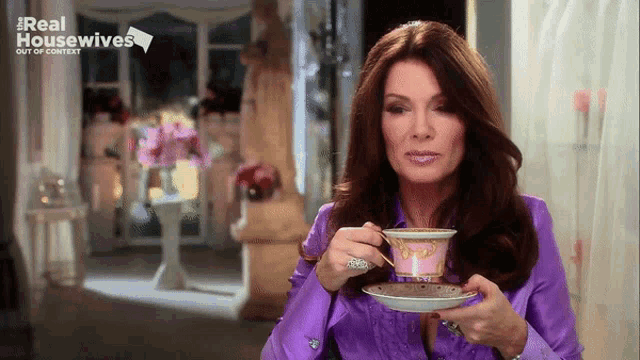 a woman in a purple shirt is drinking a cup of tea from a real housewives advertisement